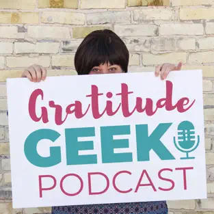 A woman holding up a sign promoting the Gratitude Geek Podcast by Beate Chelette Media.
